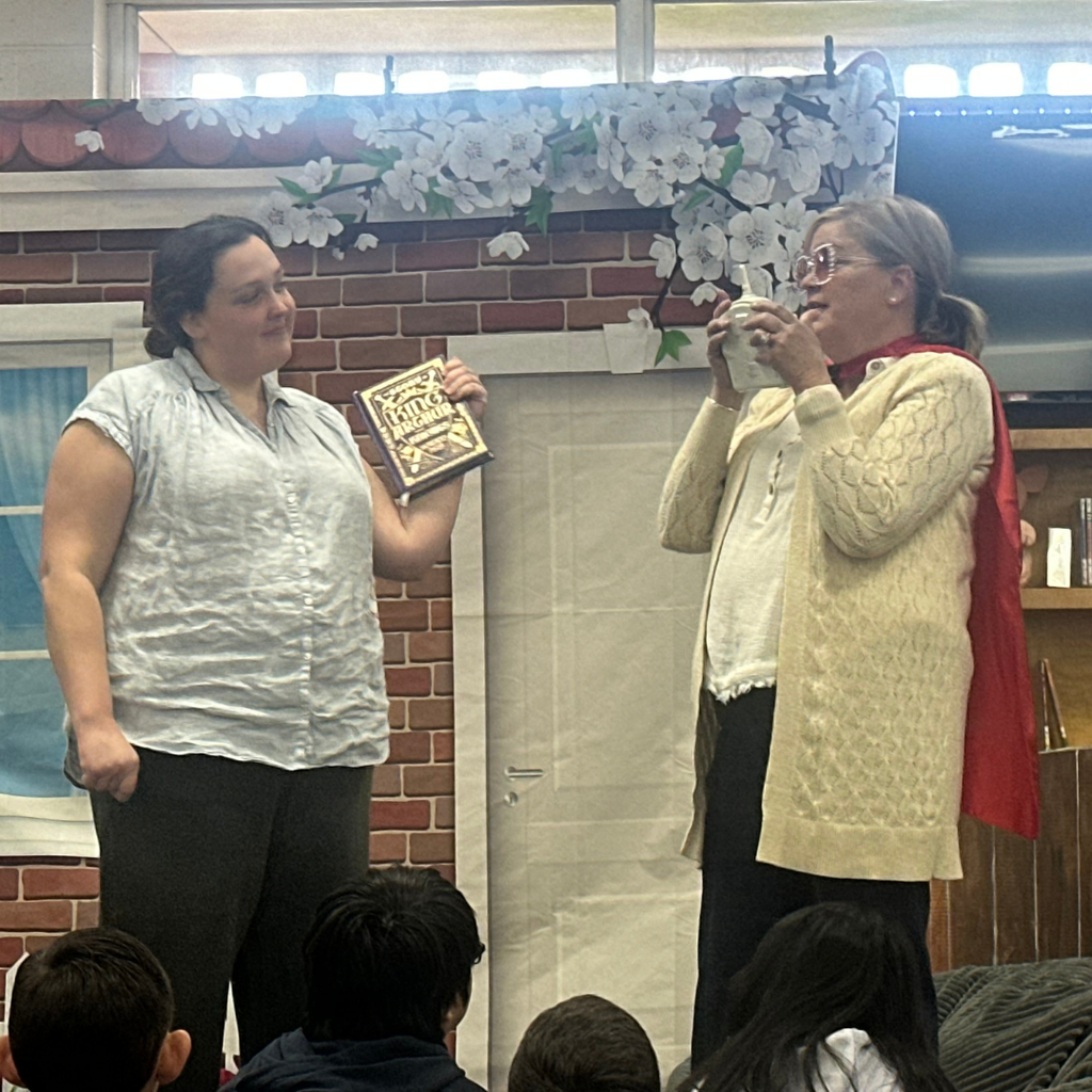 2 ladies acting out the book being read to the students