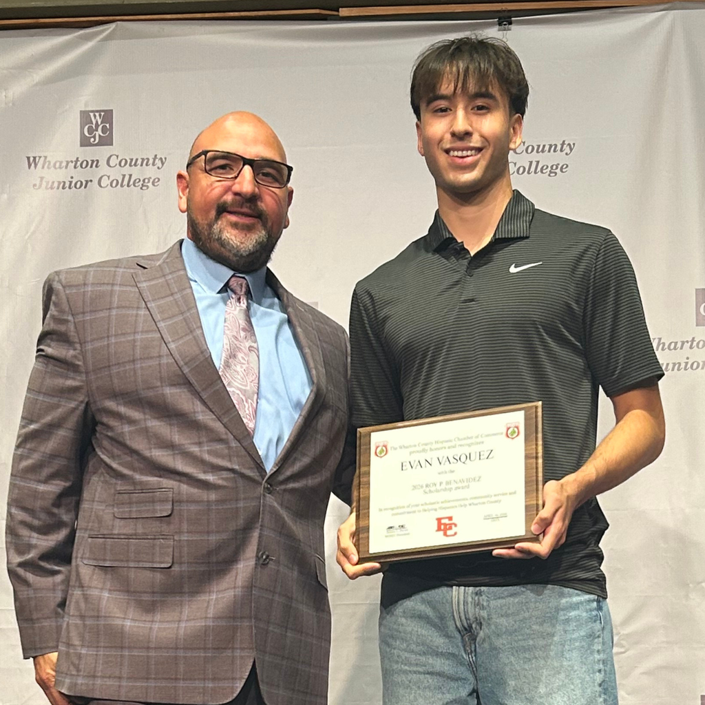 Vasquez with man in a suit