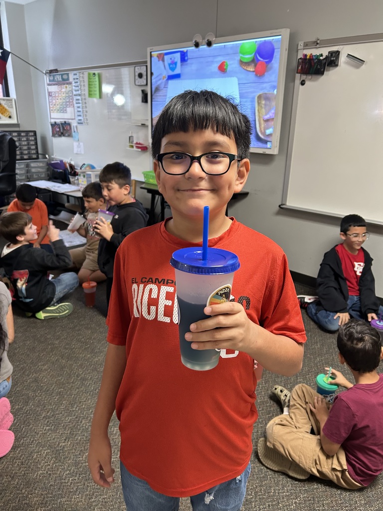 a happy boy with a plastic cup 