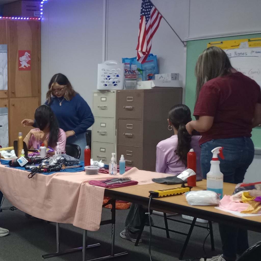 ECHS cosmetology students working on hair styles
