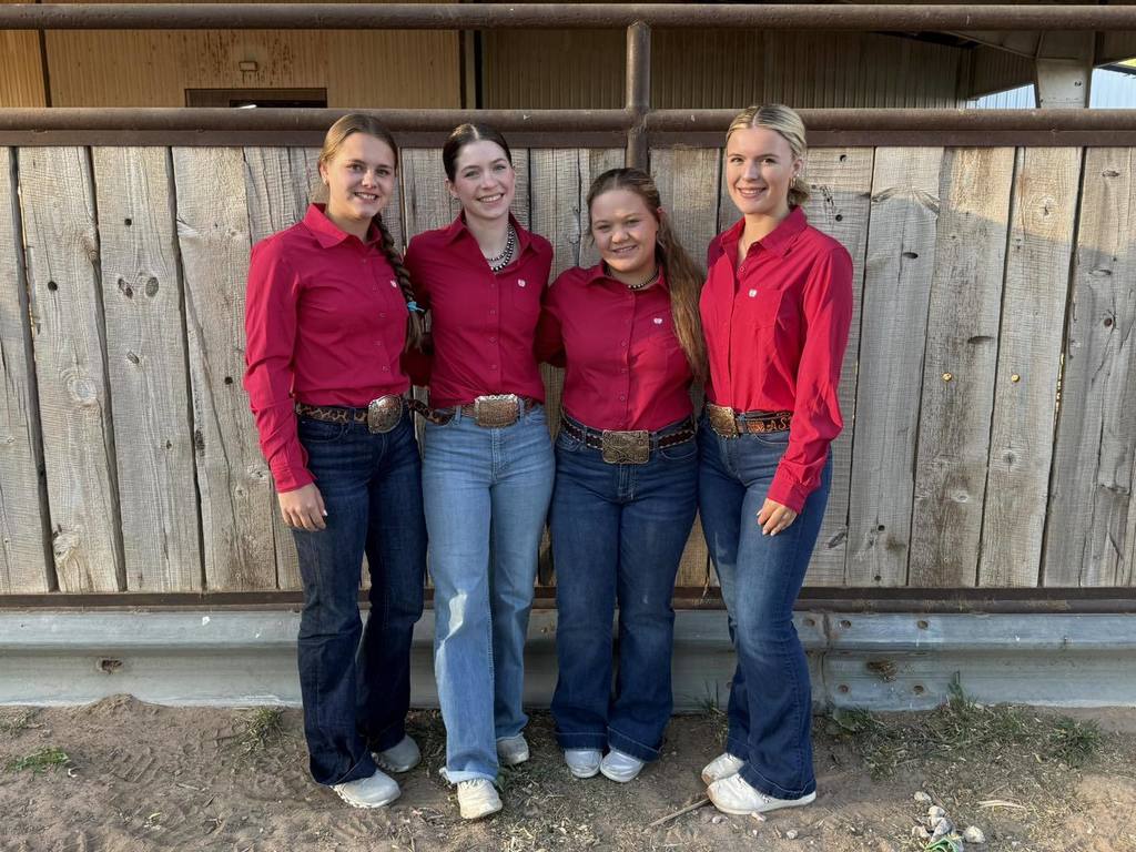 Devin, Scollie, Brennen, And Addisyn in red shirts and blue jeans