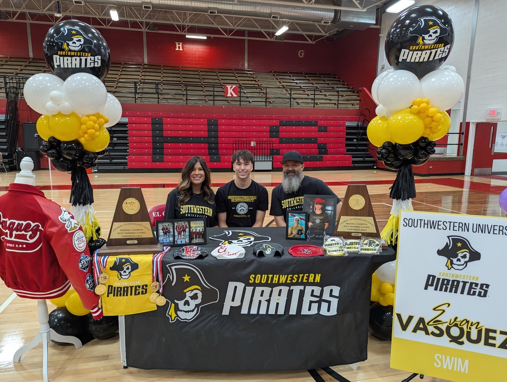 vasquez and parents at decorated table