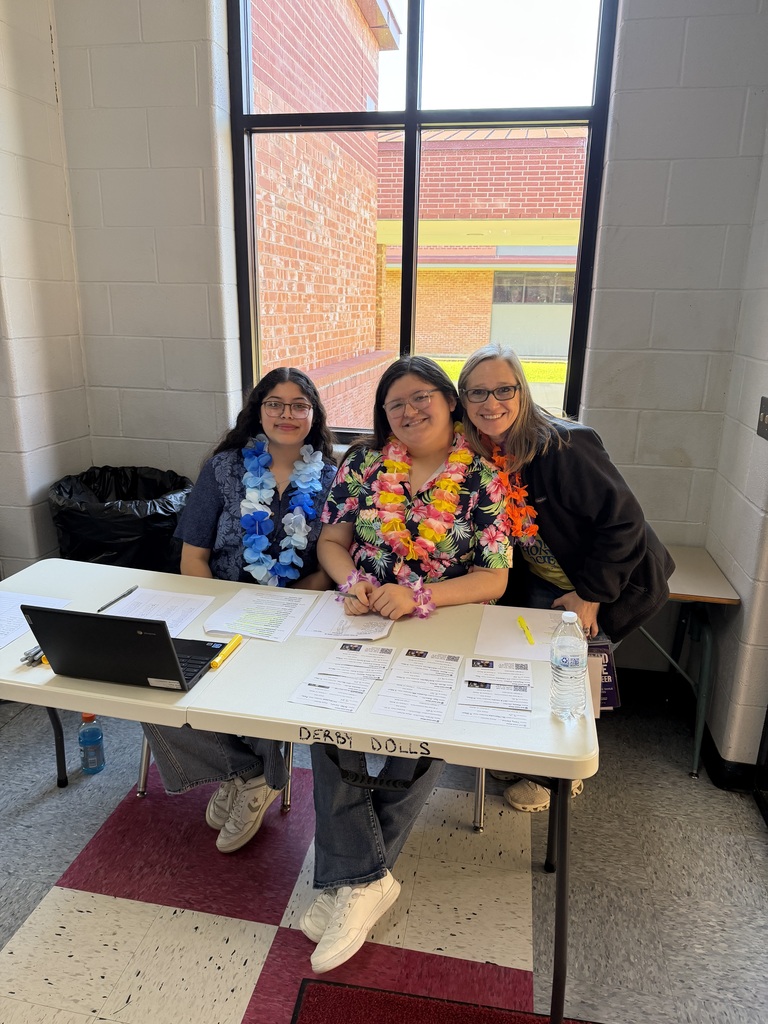 2 students and a teacher at the blood drive wearing leis