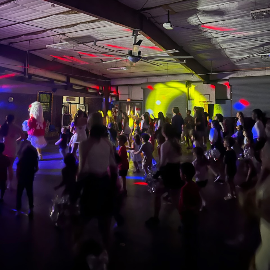 ricky leading the dancing in neon lights