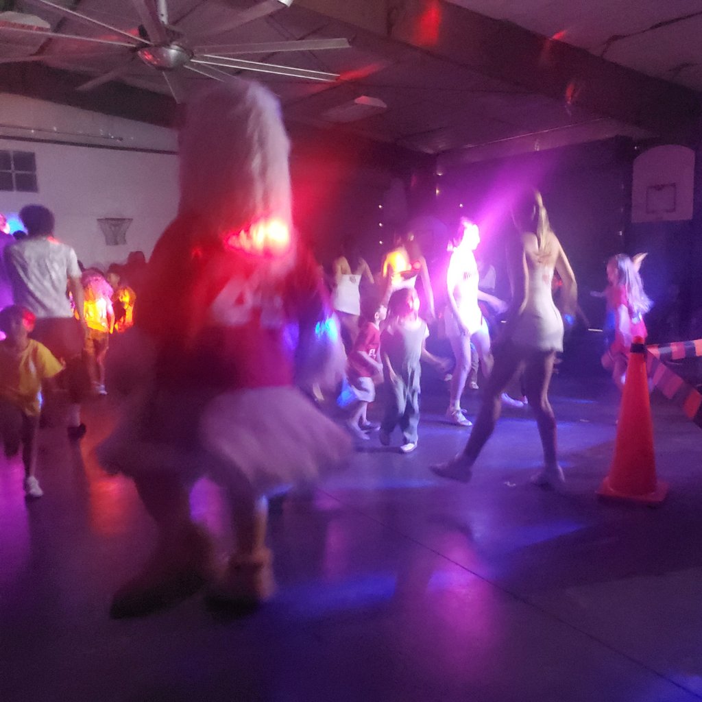 ricky leading the dancing in neon lights