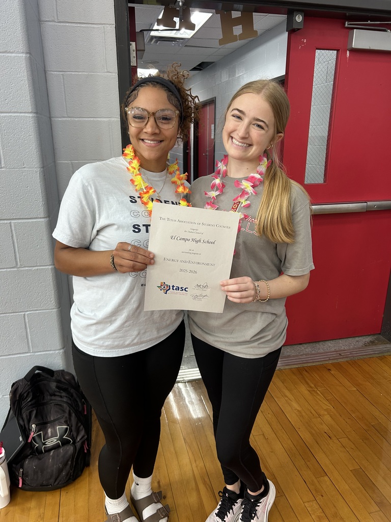 2 girls holding an award