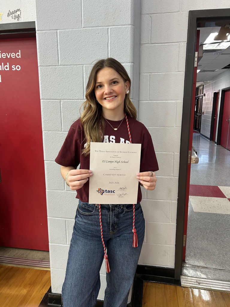 a girl holding an award