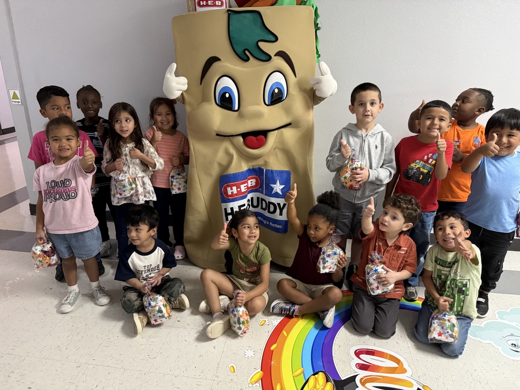 A photograph of the H-E-Buddy mascot posing with students  from Peterson's class at Myatt, celebrating their Earth Day plastic bag collection win.