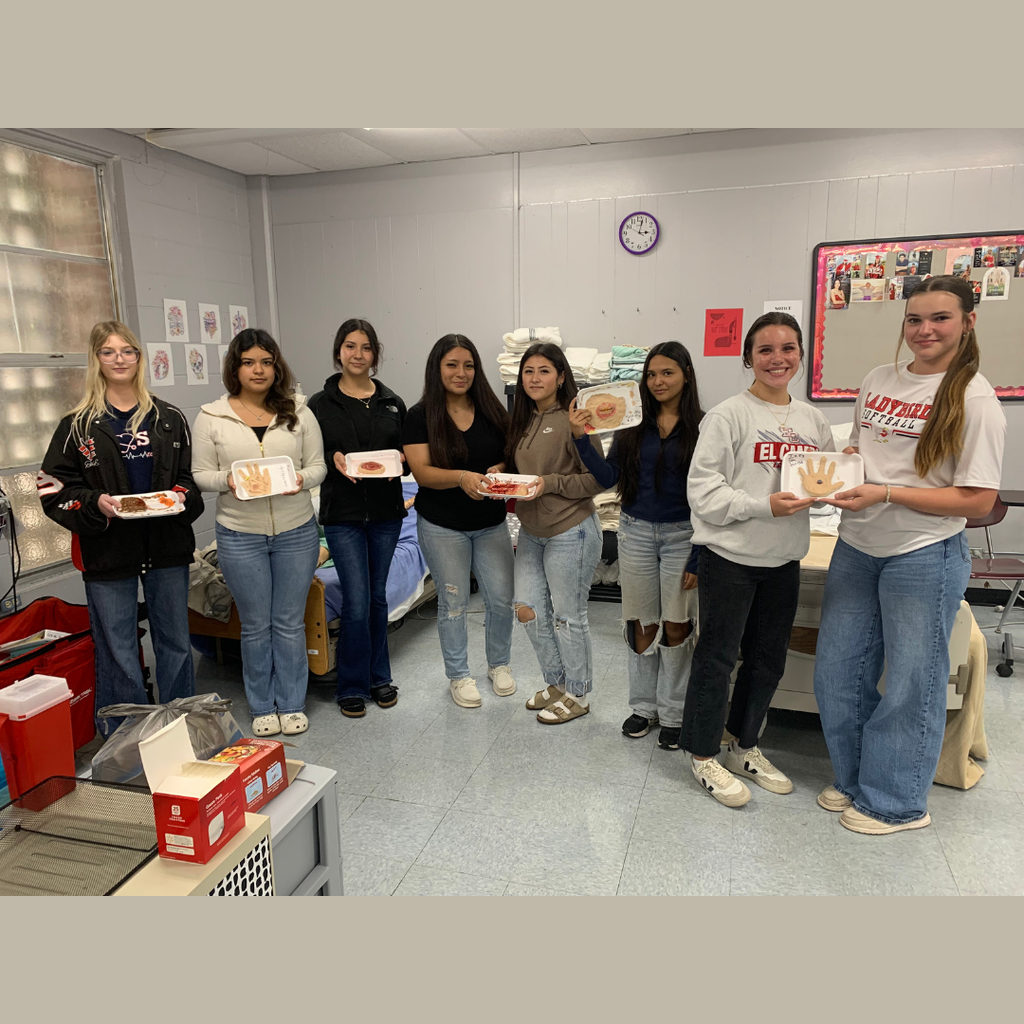 class picture of students holding their wound