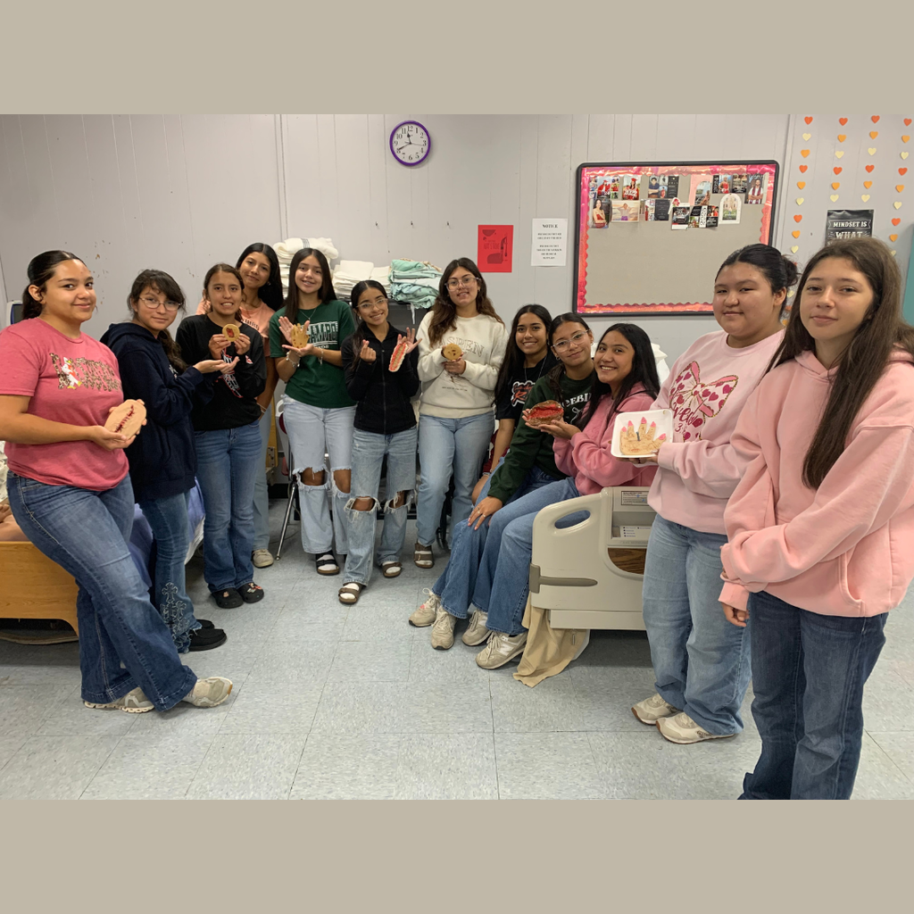 class picture of students holding their wound