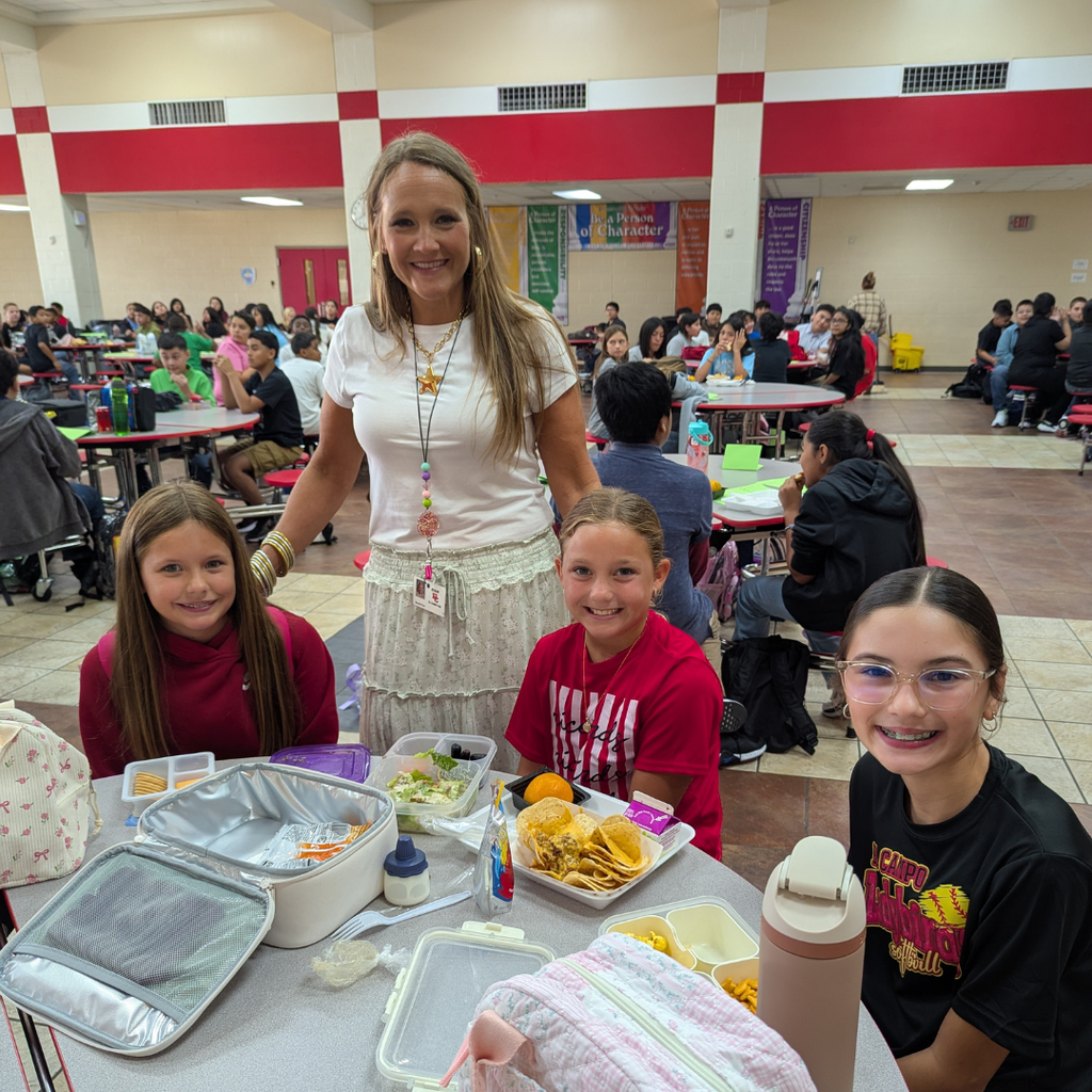 three girls at lunch visiting with teacher