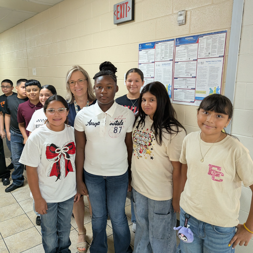 group of student in lunch line talking with the principal