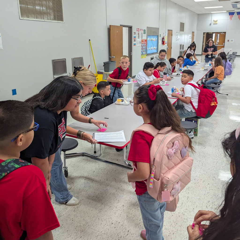 adults helping children find their teacher's name