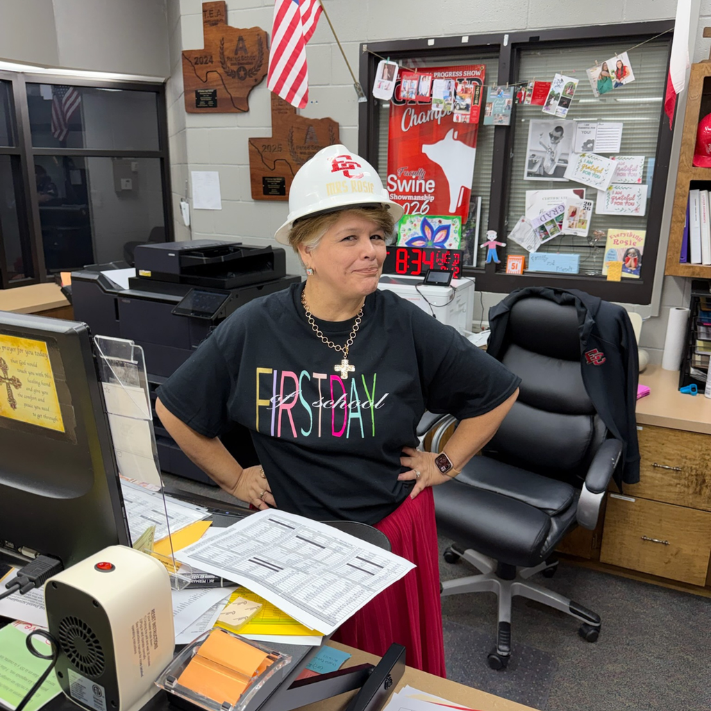 office working in hard hat and first day of school shirt