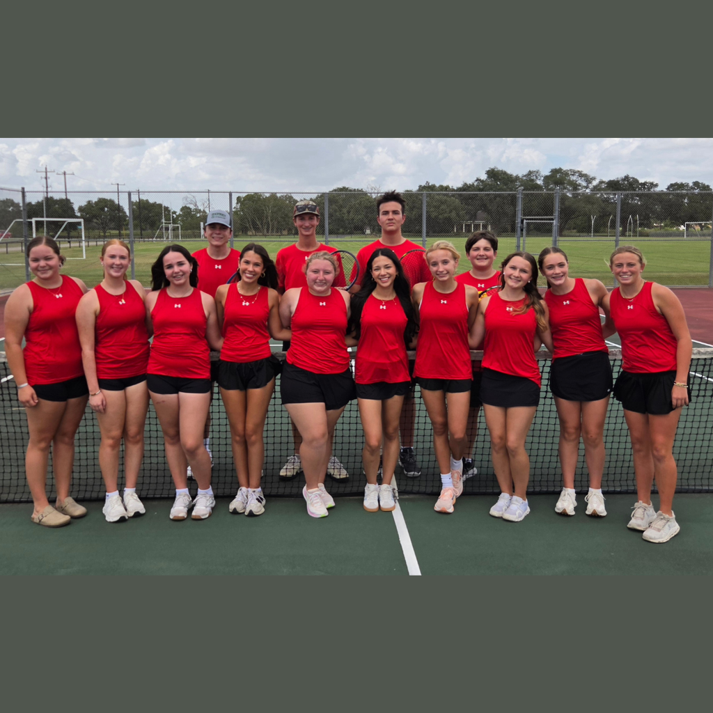 14 high schoolers in red tops and black shorts on a tennis court