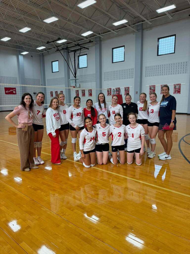 volleyball girls posing with teachers
