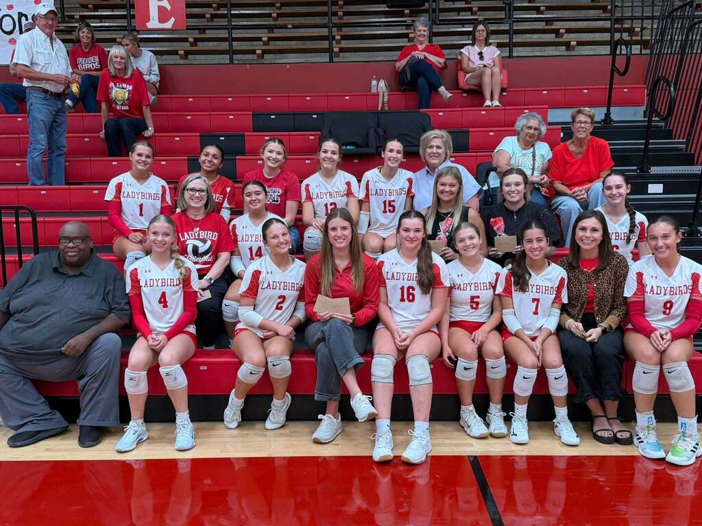 volleyball girls posing with teachers