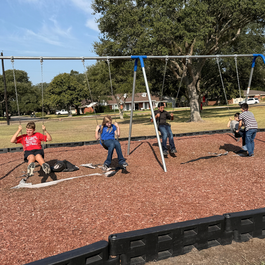 high school boy and elementary kids swinging