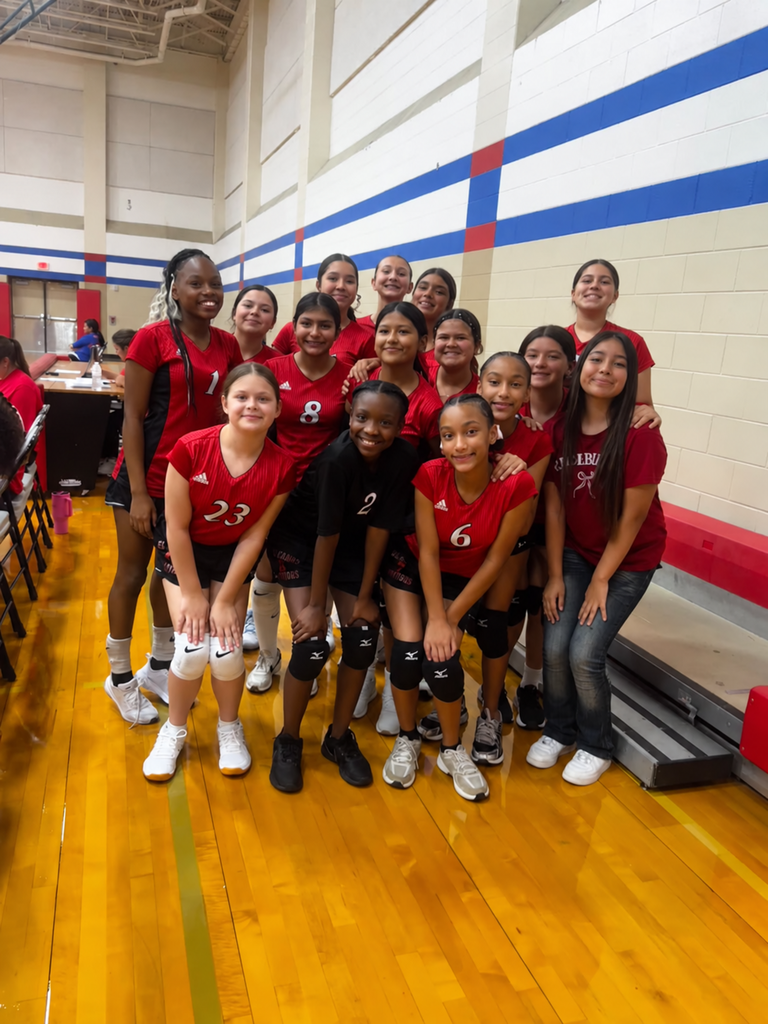 Members of the El Campo Middle School Ladybirds volleyball team 2 posing together in uniform indoors.