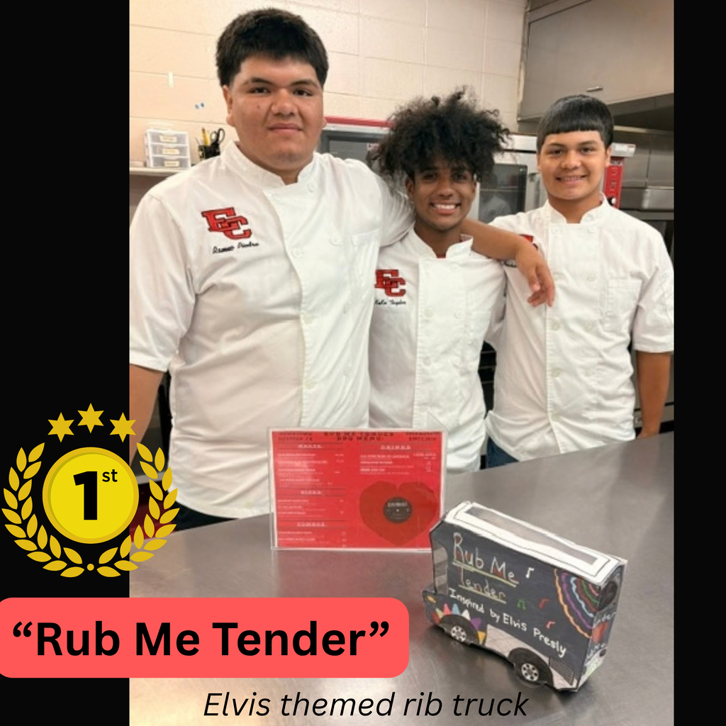 Three male culinary arts students wearing white chef coats stand together behind a counter. On the counter sits a "1st Place" gold medal graphic, a red certificate, and a miniature toy food truck labeled "Rub Me Tender" with text below reading "Elvis themed rib truck".