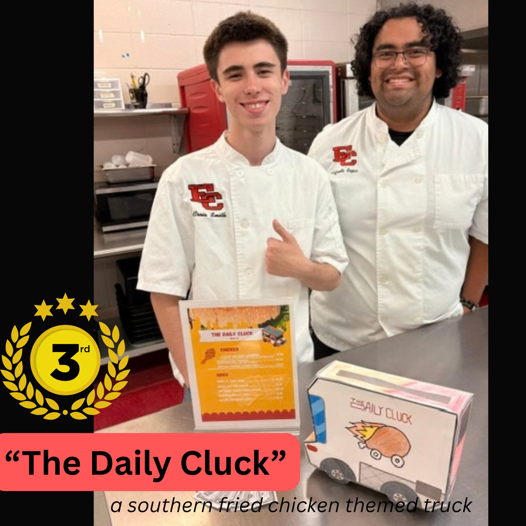 Two culinary arts students stand together behind a counter wearing white chef jackets embroidered with the school logo. A gold badge in the lower-left corner indicates 3rd place. On the counter in front of them sits a certificate and a miniature paper model of a food truck labeled "The Daily Cluck."