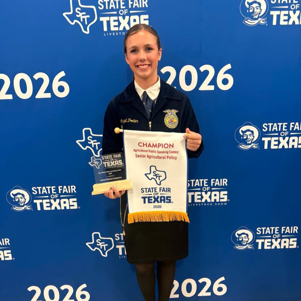 abigail with her "champion" banner and trophey