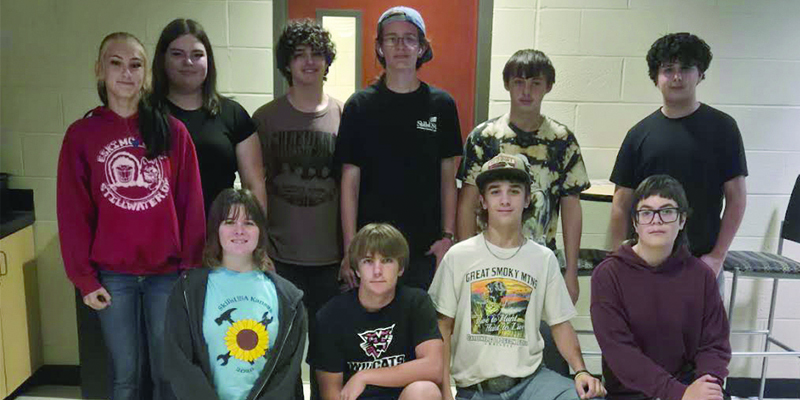 A group of students pose facing the cameral