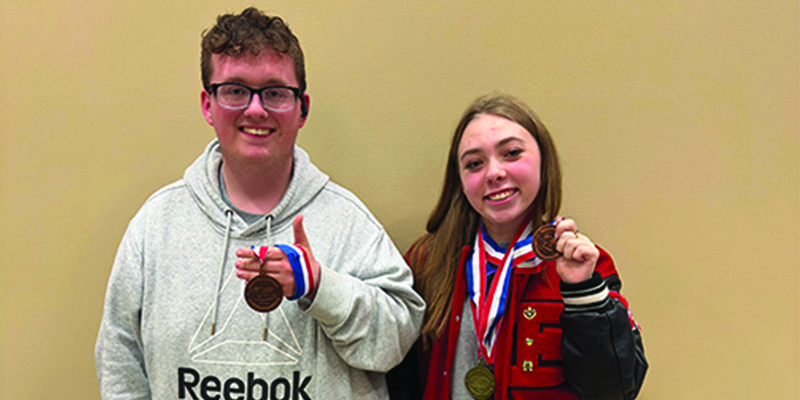 EHS students holding Science Olympiad medals