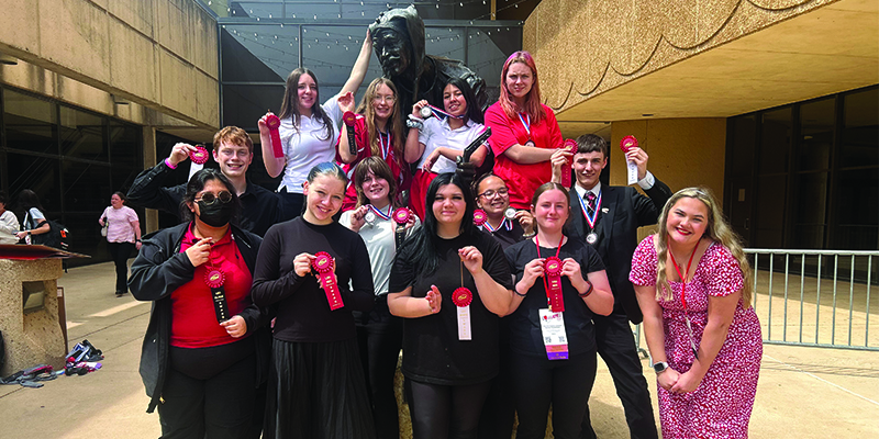 EHS FCCLA team holding ribbons from state competition