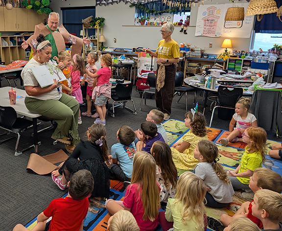 Grandview kindergarten reads Tap the Magic Tree