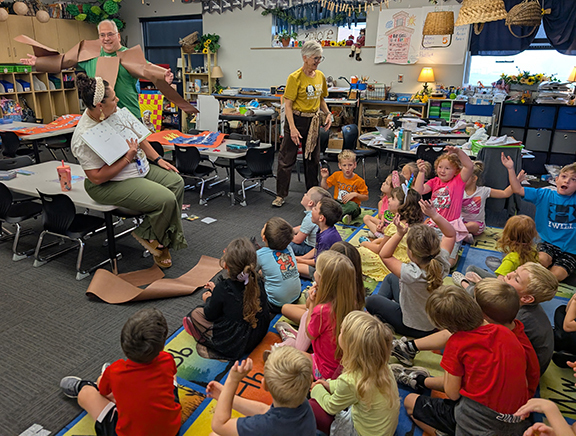 Grandview kindergarten reads Tap the Magic Tree