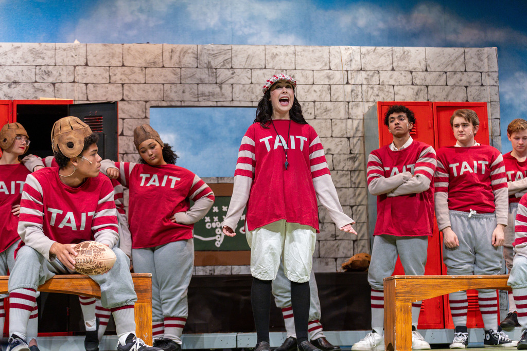 Scene from a musical of a football team