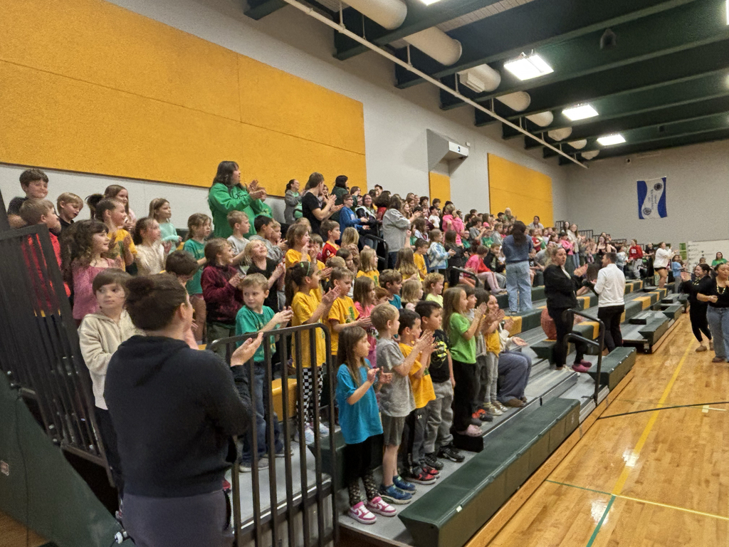 Grandview staff and students cheering on the EHS cheerleaders and band