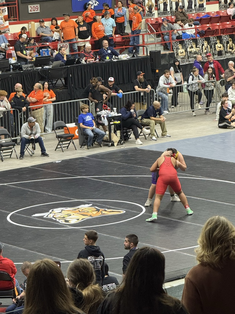 two boys wrestling at the state tournament