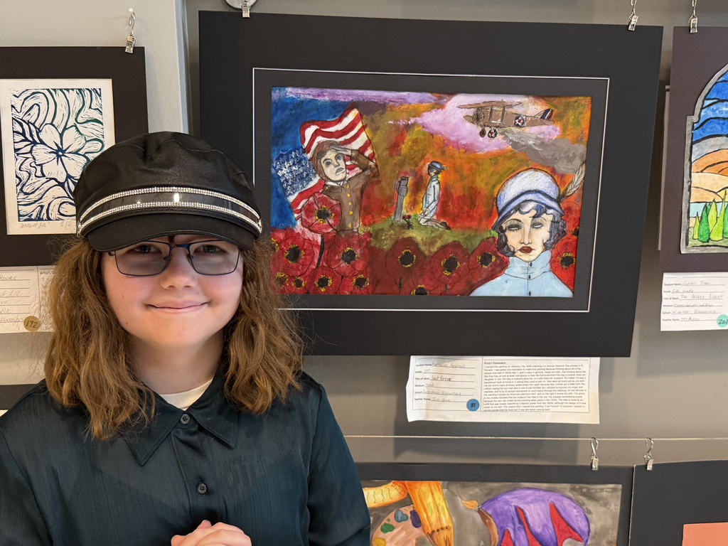 Katharine stands with her art piece