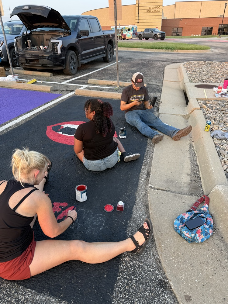 seniors painting parking spots