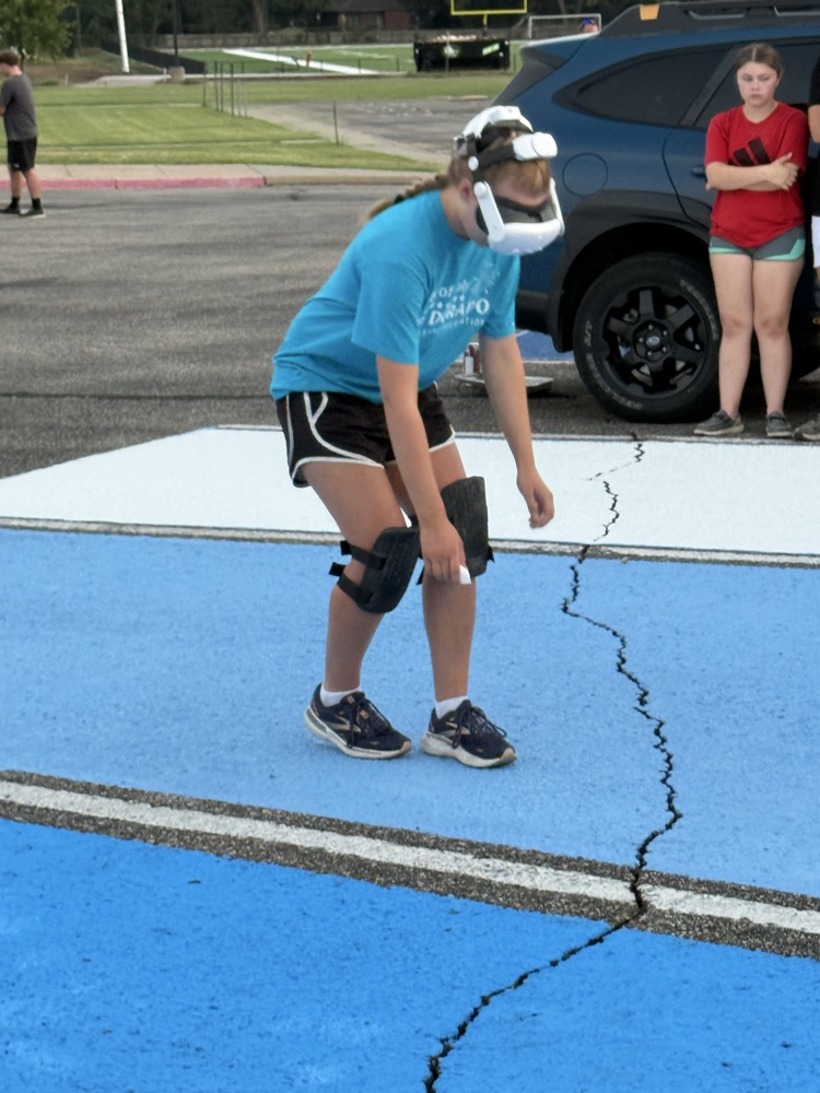 seniors painting parking spots
