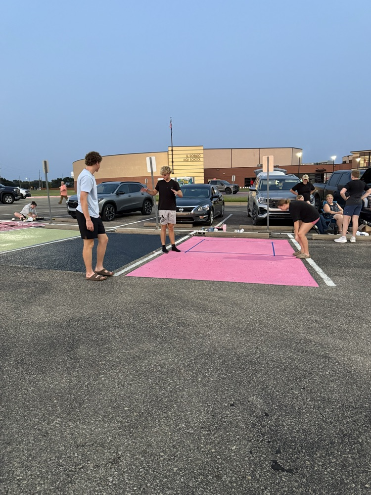 seniors painting parking spots