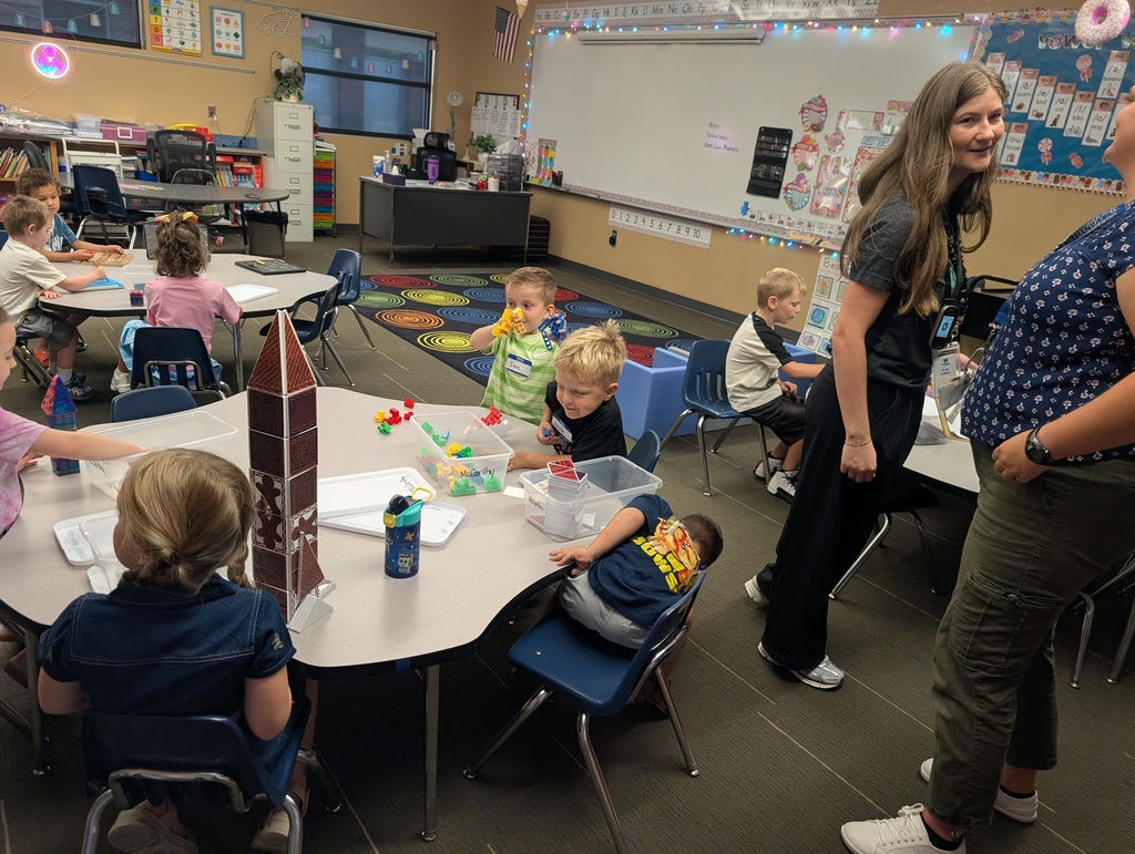 students playing with building blocks at a table