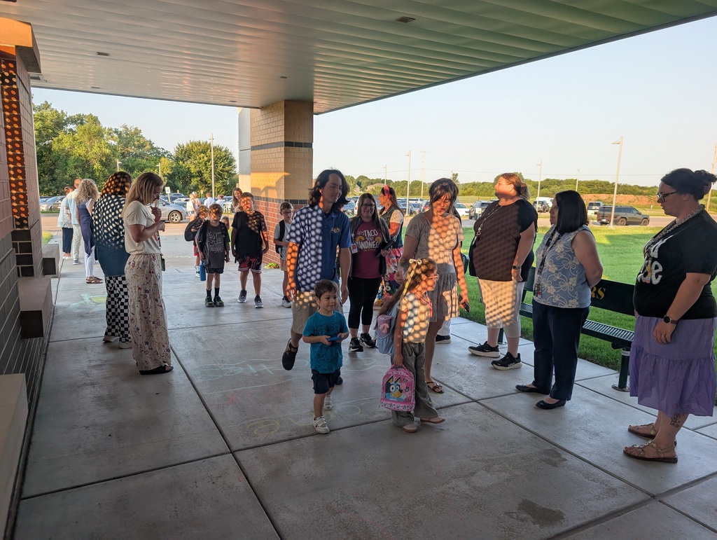 staff greeting students and parents as they enter Grandview