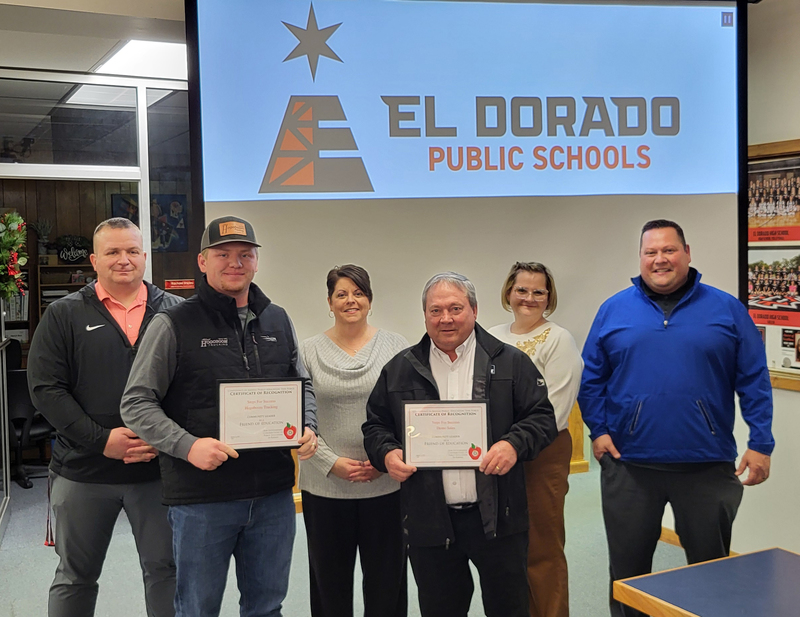 USD 490 admin and representatives from Demo Sales and Hogoboom Trucking pose with Friend of Education award certificates