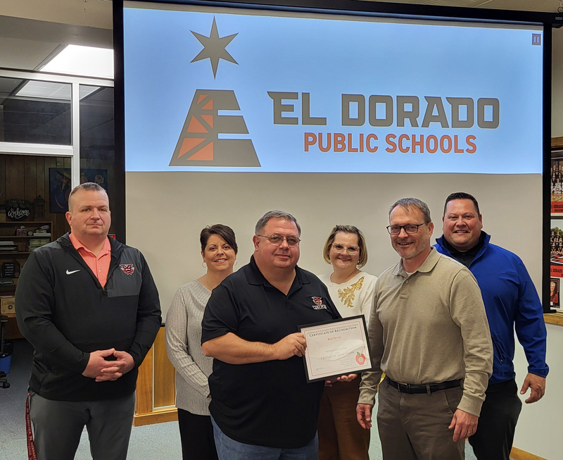 USD 490 admin and representatives from Red Devils pose with 2026 Friend of Education certificate