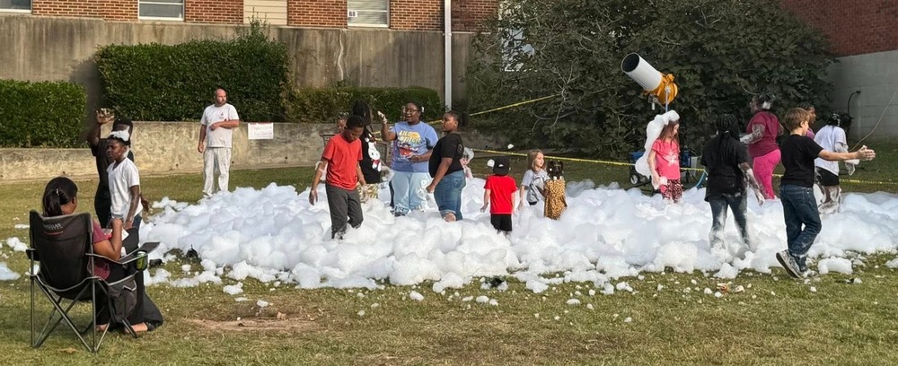 students playing in a foam thrower