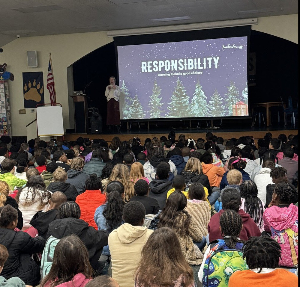 principal talking to a room full of kids about responsibility