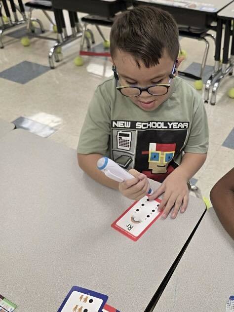 student working on recognizing letters