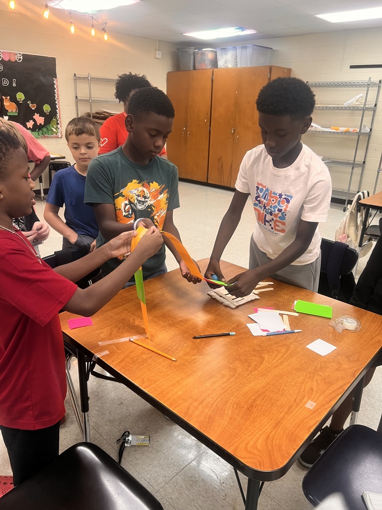 Students building roller coasters