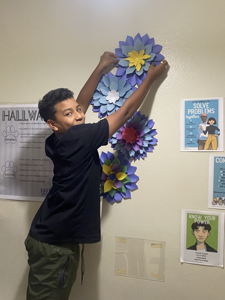 boy hanging flower 