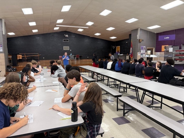 Ms. Cook speaking for 9/11 & kids completing questionnaire