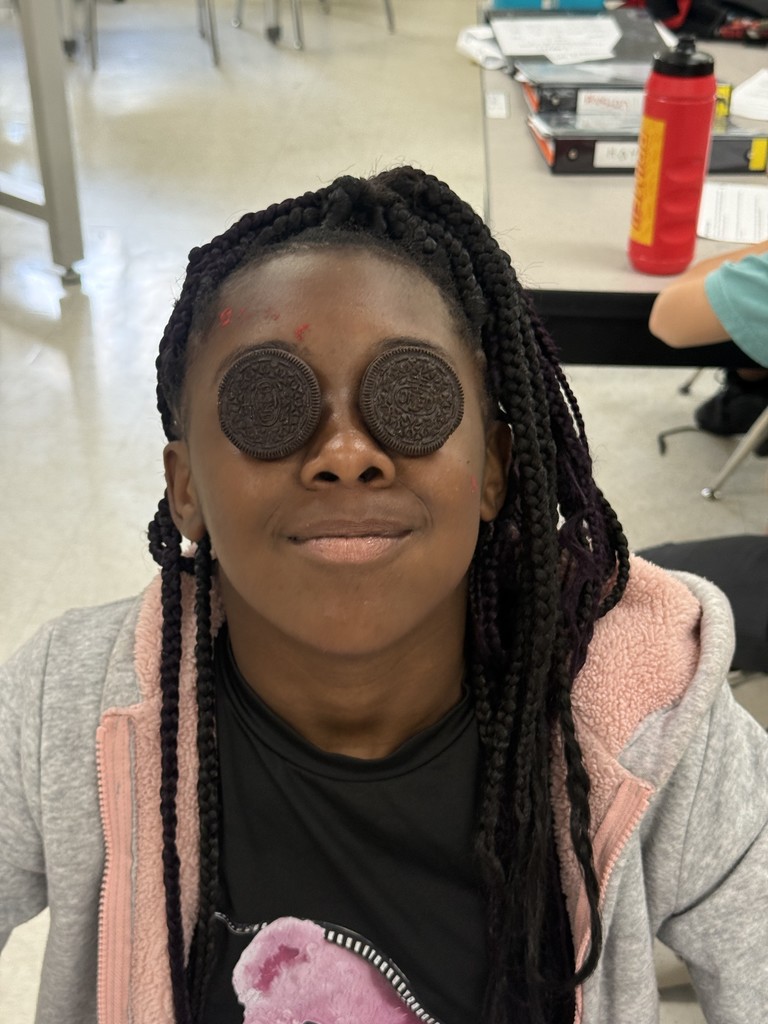 Student with oreos on her face