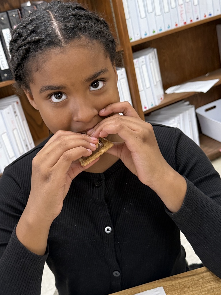 student eating smores